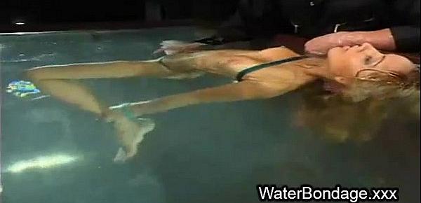 Tied blonde hottie tortured with ice and sunk in water tank